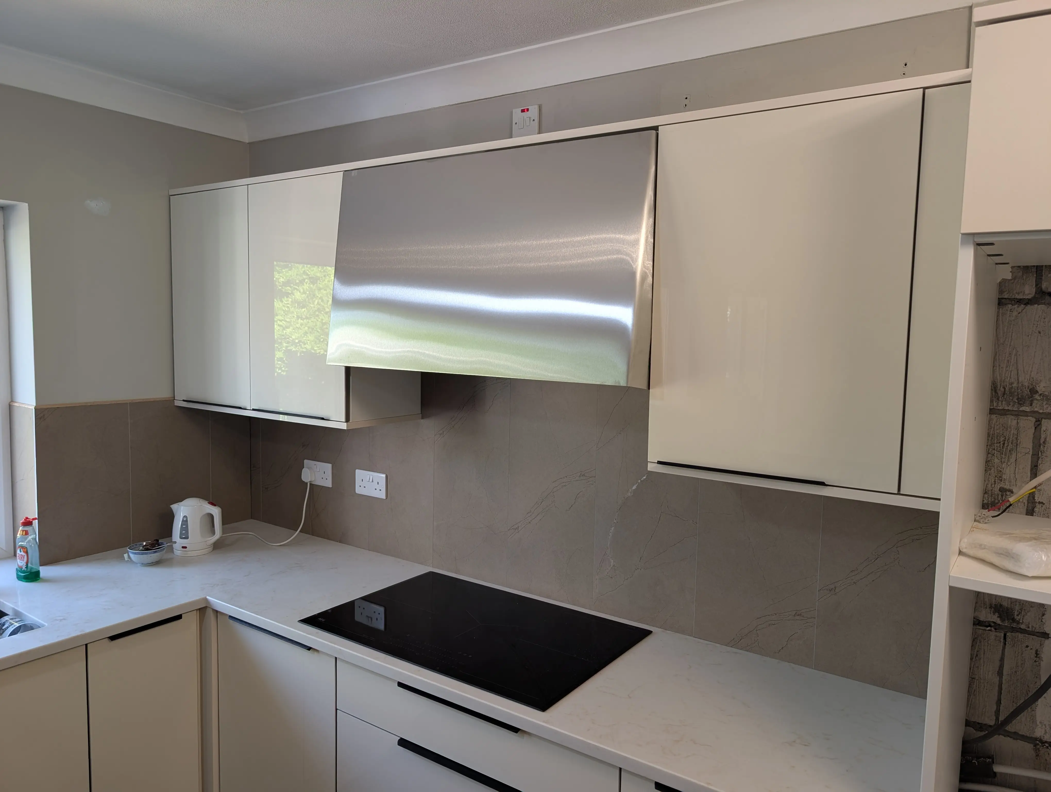 John Mclevy - A Bespoke Stainless Steel Extractor Surround
